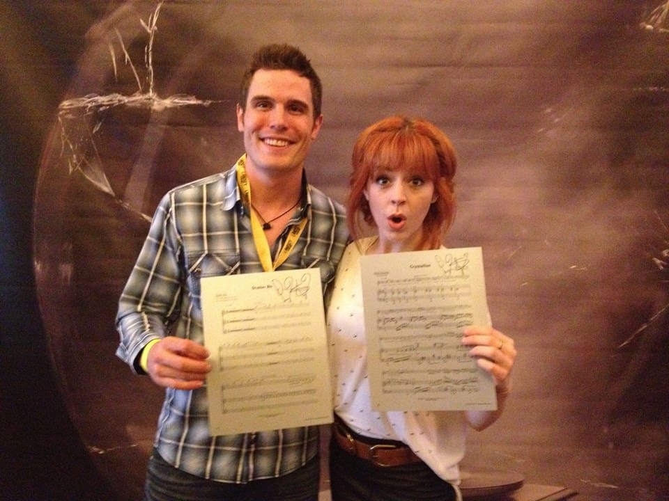 Lindsey, with MN team member Dan, signed print-outs of her digital sheet music to hang in our office.