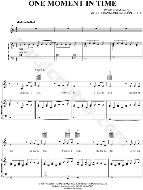 who wrote the song one moment in time