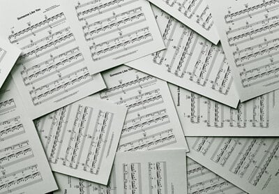 Scattered pages of printed sheet music